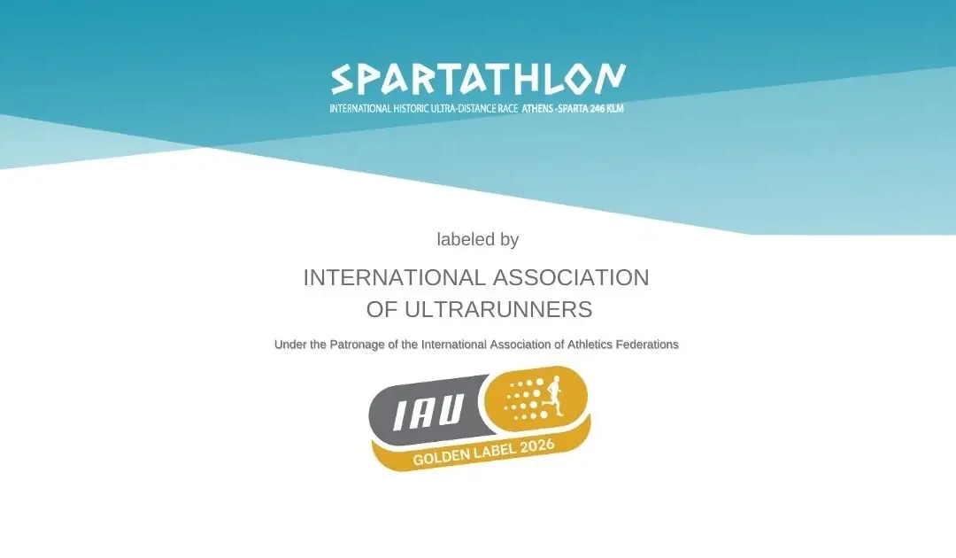 Logotipo oficial del Spartathlon y certificado IAU Golden Label 2026, con fondo azul y blanco.